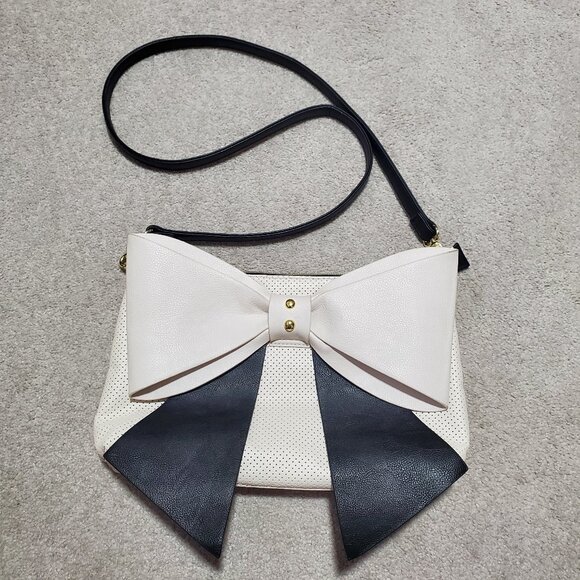 Betsey Johnson Handbags - BETSEY JOHNSON Crossbody Bow Bag Purse Faux Leather Perforated Black White Gold